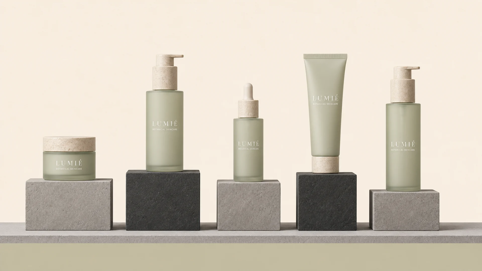 The LUMIE collection on stone plinths against a warm bone cream backdrop